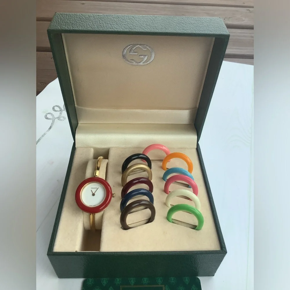 Gucci Women’s Gold Bangle Watch with Interchangeable Color Bezels